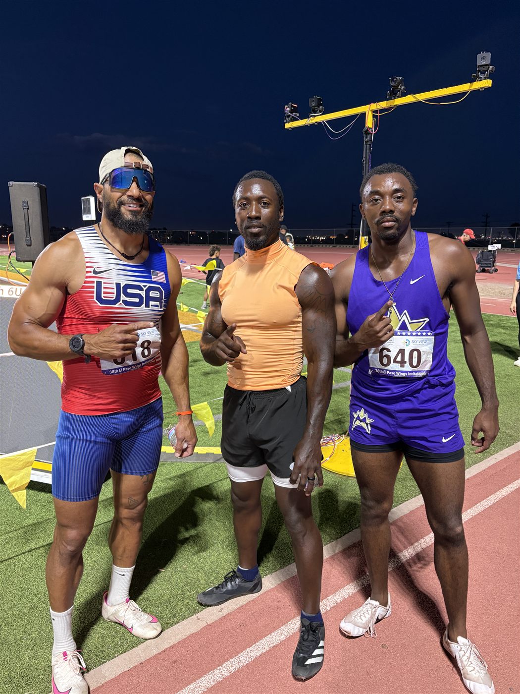 Siddeeq Shabazz in his Team USA kit with two fellow sprinters after a race at the El Paso Wings Invitational