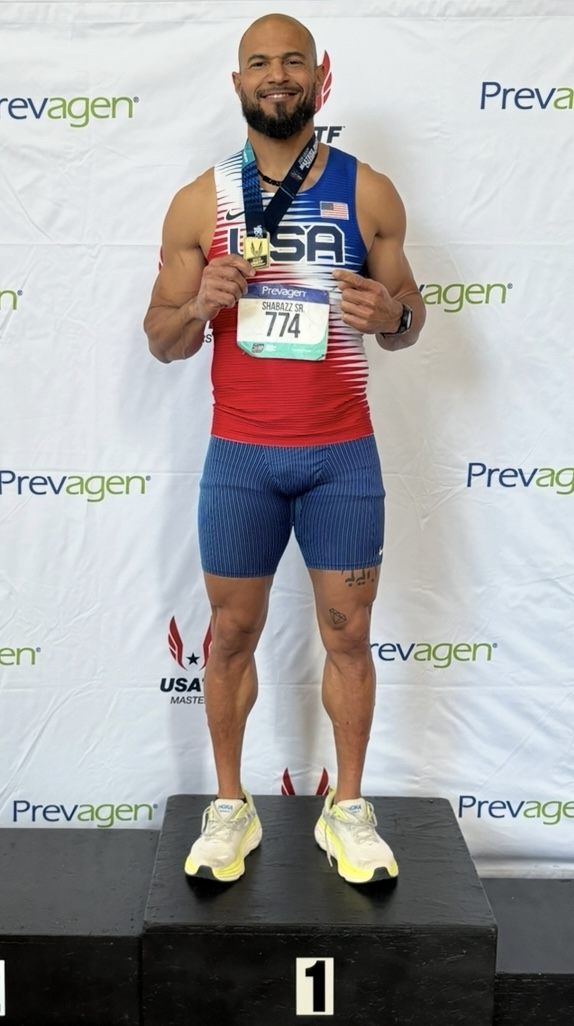 Siddeeq Shabazz on the top step of the podium in his Team USA kit, holding a national championship medal